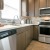 a kitchen with wooden cabinets