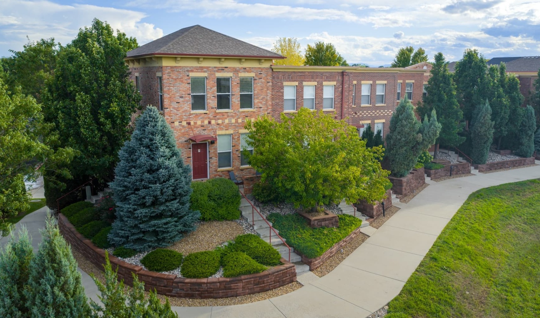 exterior of building showing the property's lush landscaping