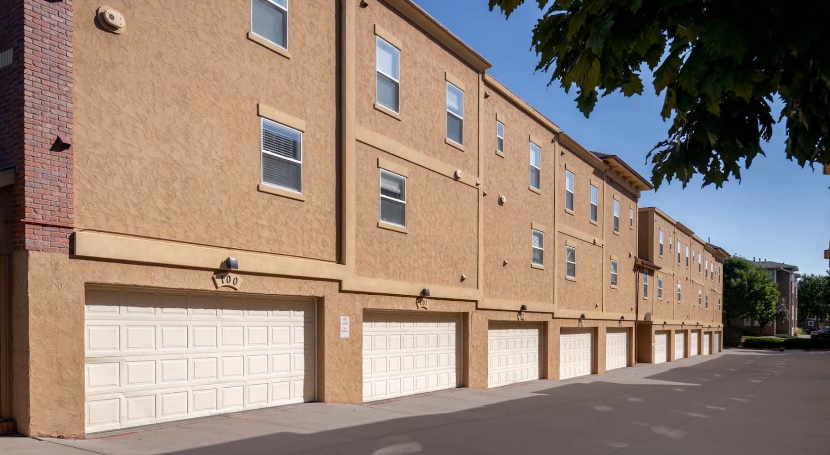 A new standard of living exterior showing garages