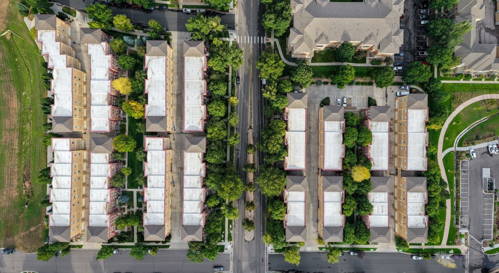 The essence of exceptional living aerial showing property, connected amenities and local area