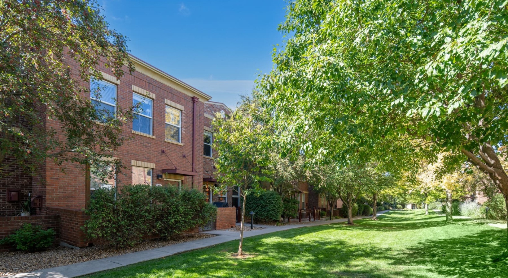 Leisure meets luxury lush landscaping surrounding property buildings