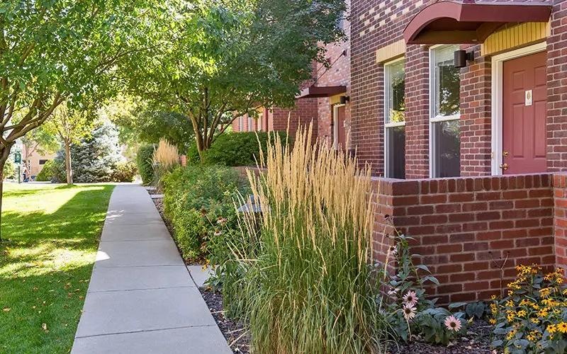 a sidewalk and a house